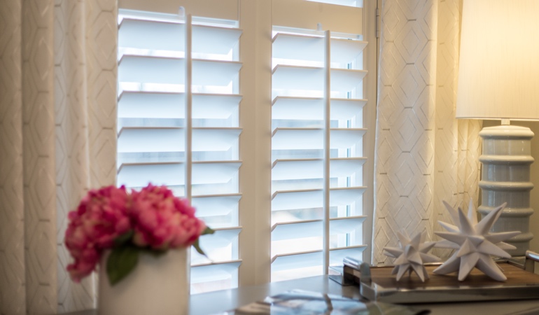 Plantation shutters by flowers in Salt Lake City